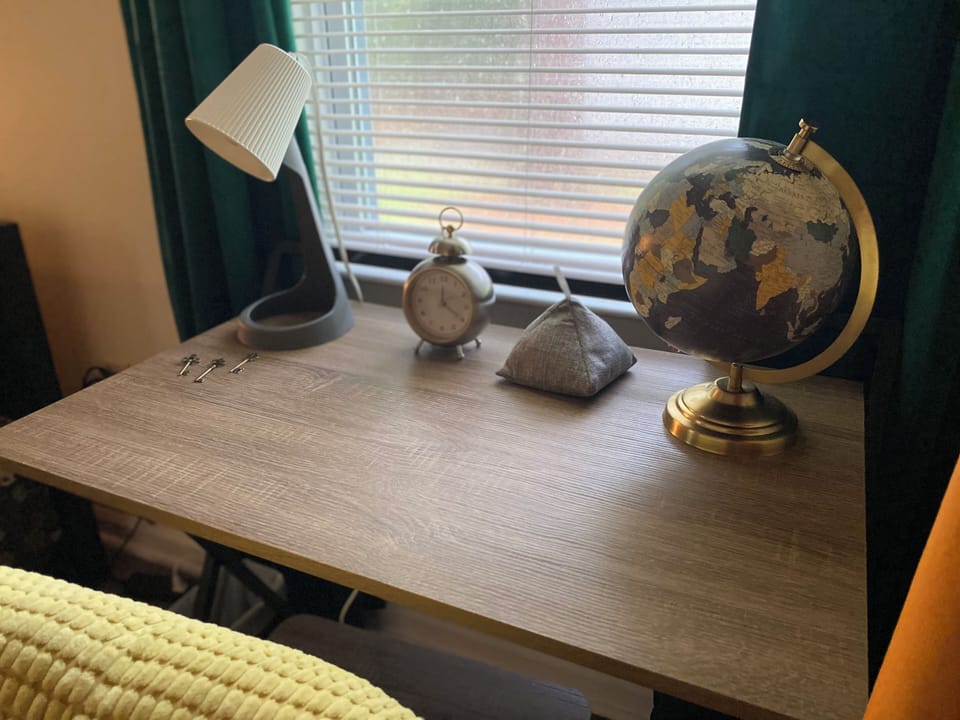 Dedicated workspace with room to write and place your laptop or tablet.