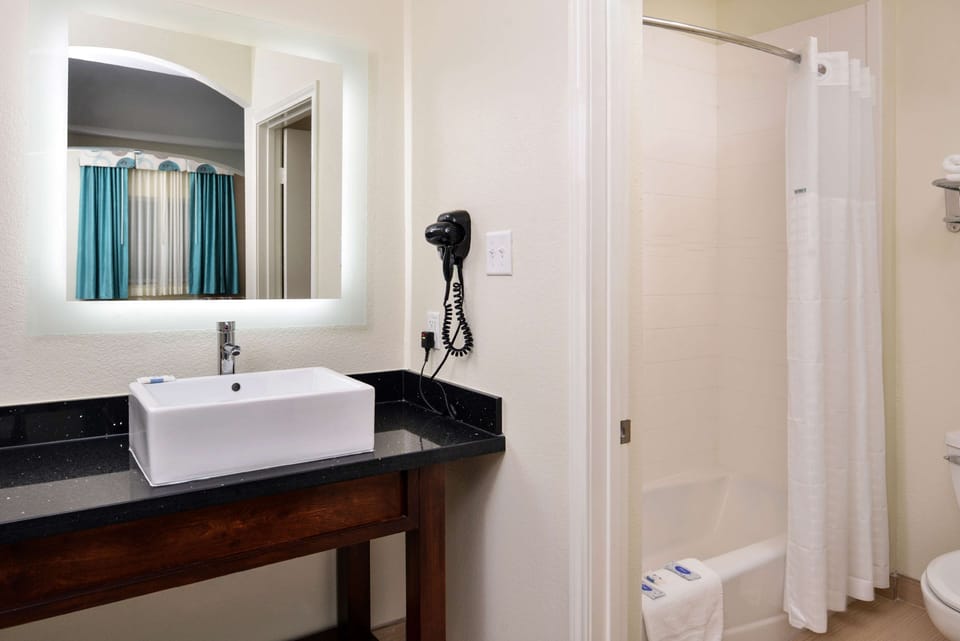 Refresh in a bright bathroom with plenty of counter space.