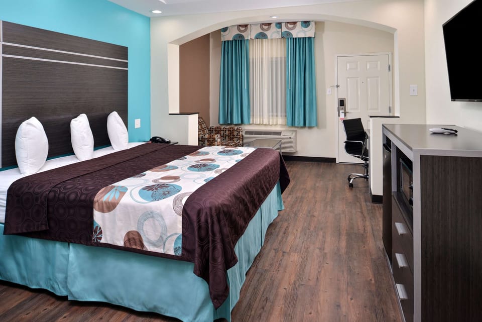 Enjoy extra room to move with desk, TV, and storage.