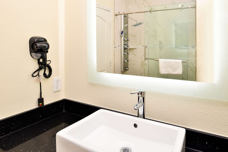 Start your day at the sleek vanity under flattering light.