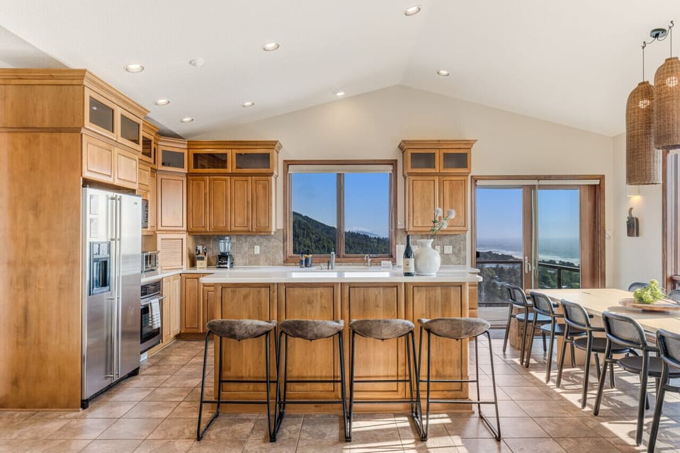 The kitchen has four bar stools