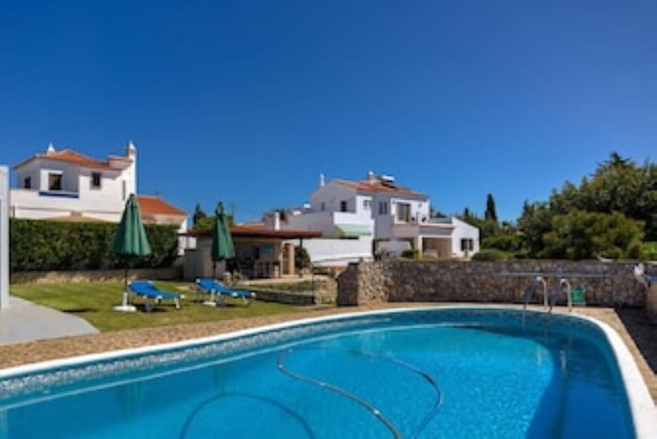 Swimming pool looking over water gardens to Casa das Primas.  Penthouse topfloor