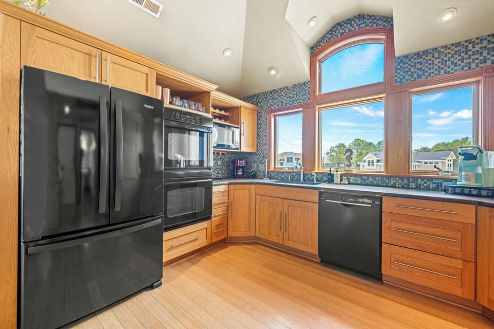 Kitchen with Bar Seating on Third Level