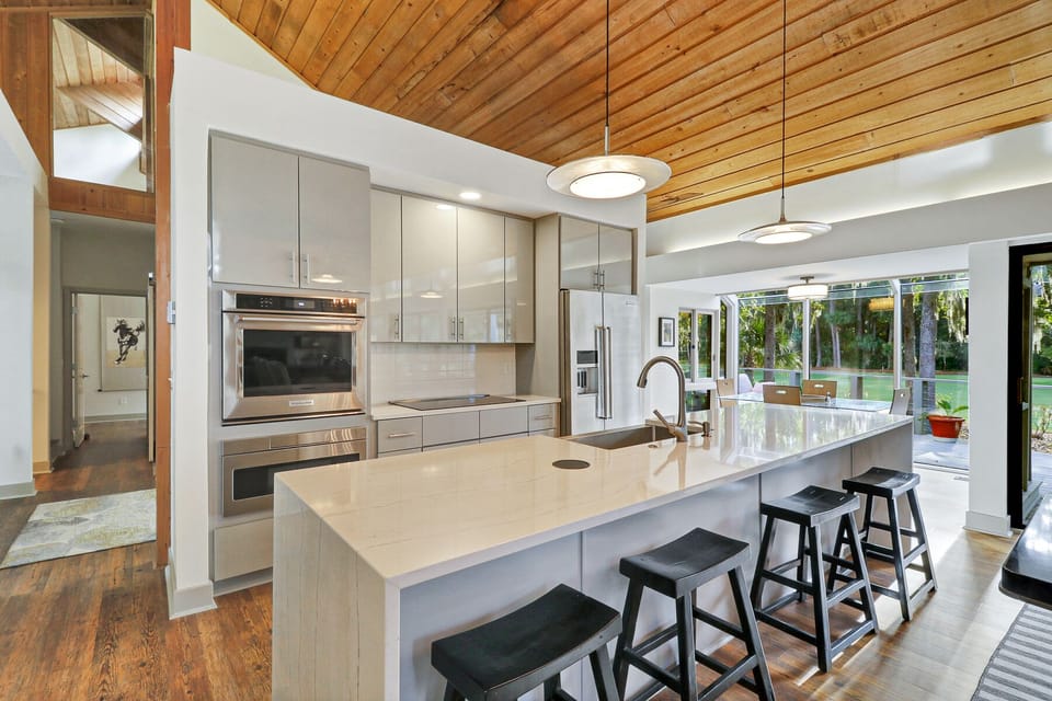 Enjoy this high end kitchen featuring all stainless steel appliances and a large island for prep space and additional seating.