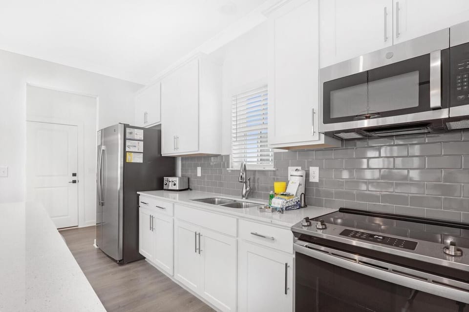 New stainless-steel major appliances and convenient countertop appliances make this well-equipped kitchen a chef's dream.