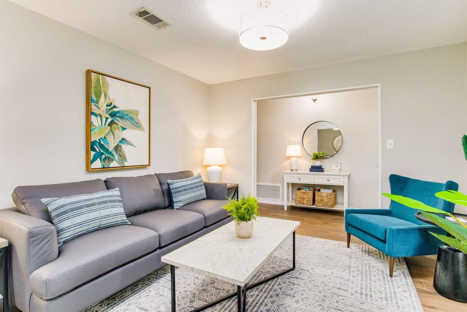 Unwind in our spacious living room, complete with plush couches and stylish decor.