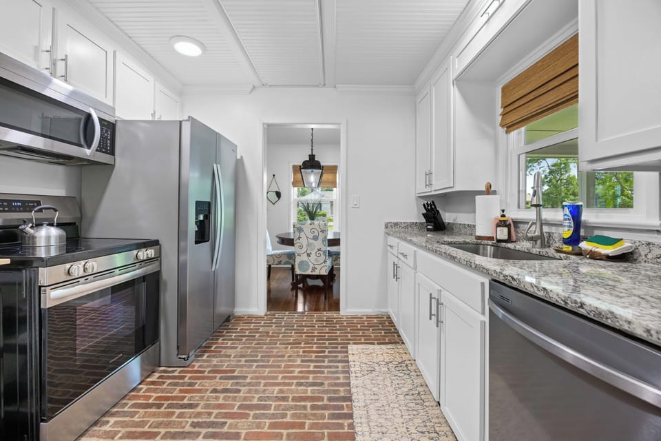 Full view of kitchen appliances including oven, microwave, frig, and dishwasher