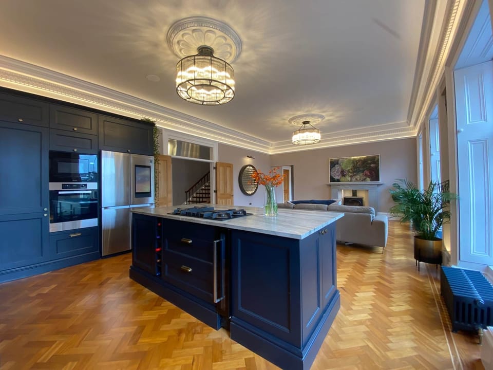 The entire lower floor encompasses a beautiful reclaimed parquet floor