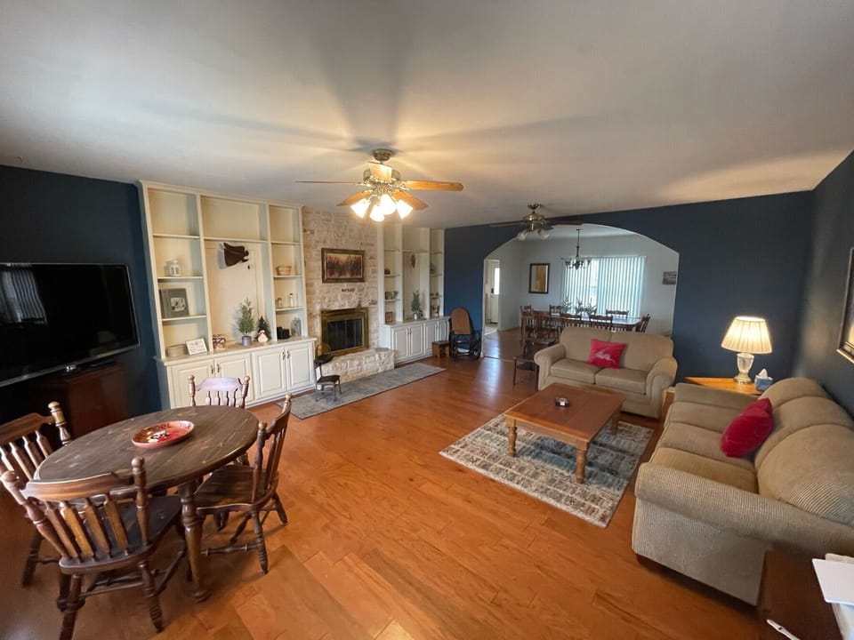 View from front door into Large Living area and dining room in the back.
