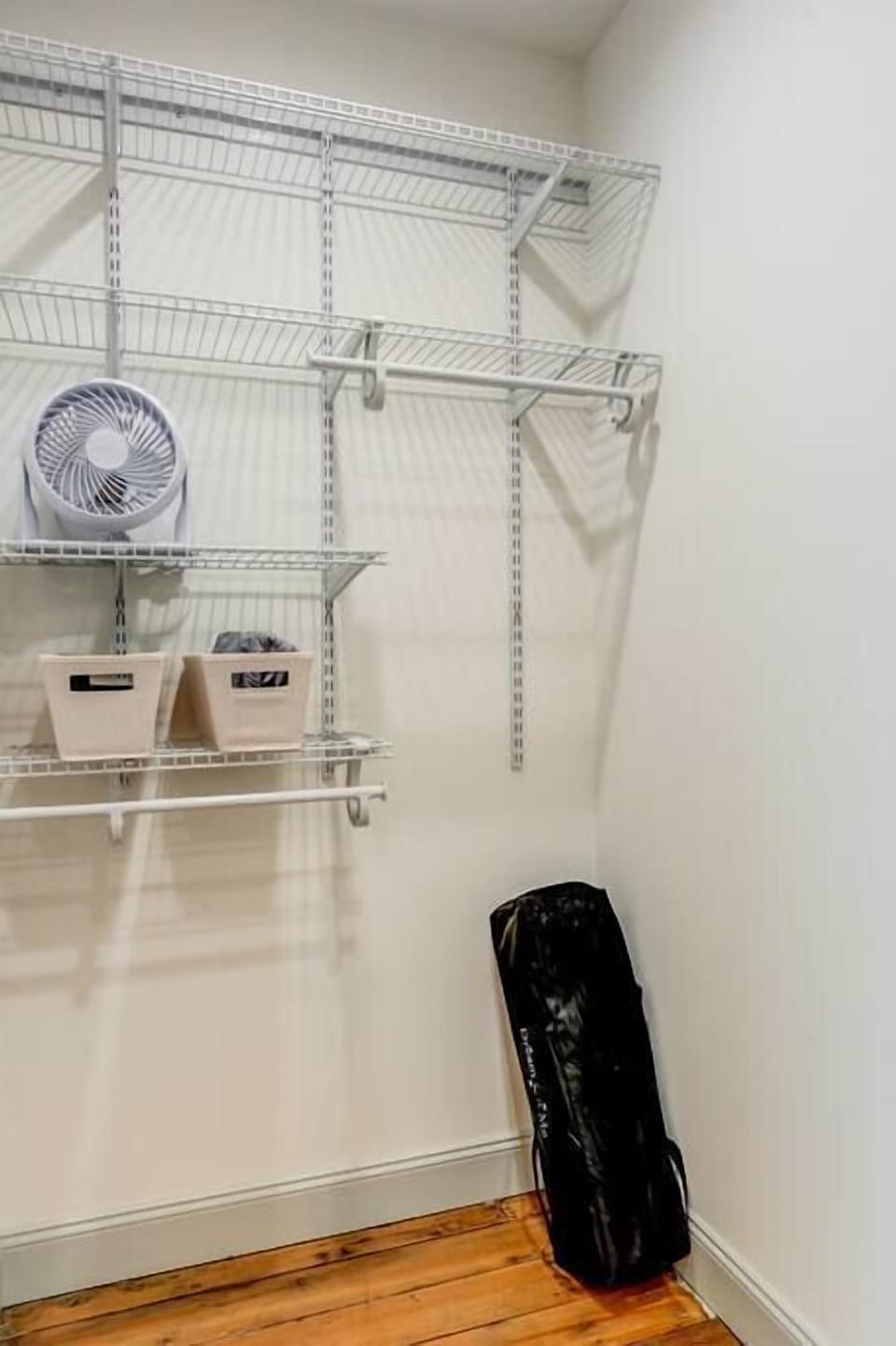 A pack n play and pack n play sheets are stored in the master bedroom closet