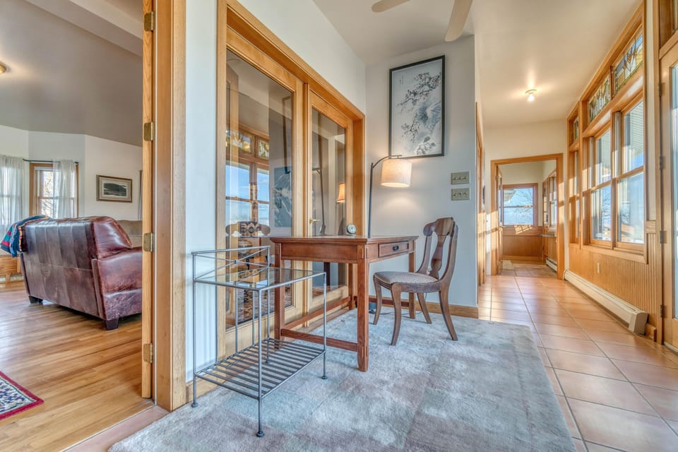 A dedicated workspace off the sun room providing lots of natural light and a cozy space to work in.