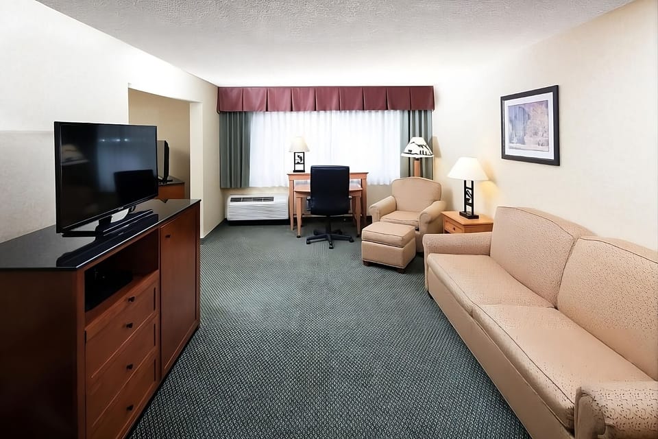 Stretch out and relax with roomy seating and in-room workspace.