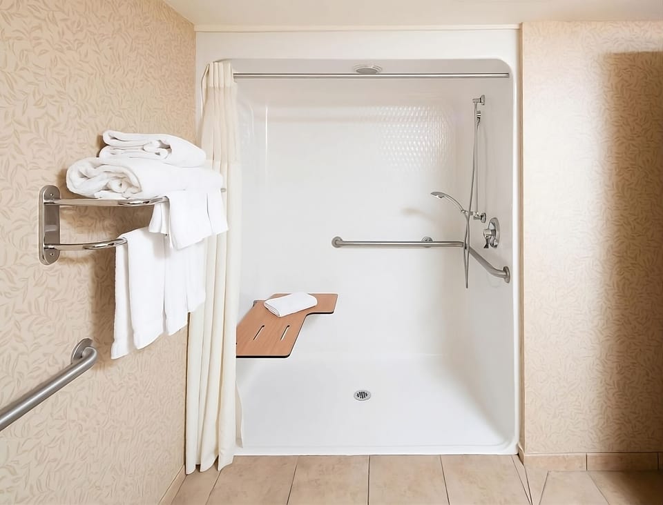 Refresh easily in a walk-in shower with safety grab bars.