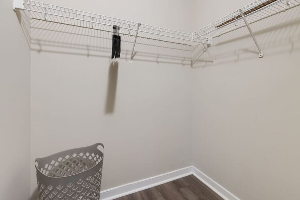 Relax in comfort with a king-size bed, ergonomic desk and chair, flat-screen Roku TV, ceiling fan, and a spacious ensuite bathroom with a double vanity and shower/tub combo.