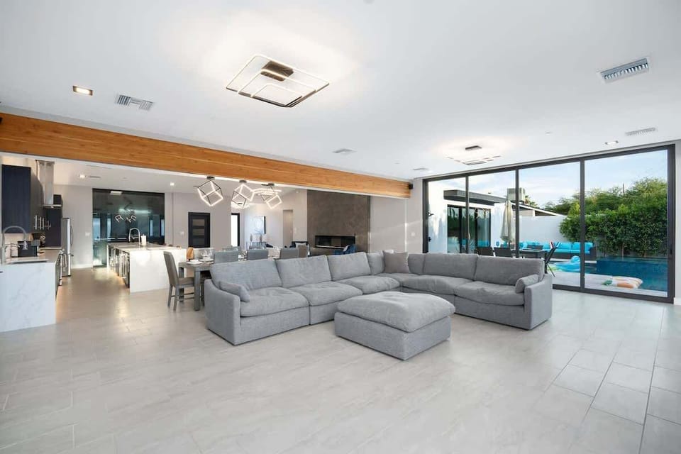 The open concept indoor with a spacious living area, dining area, and kitchen.