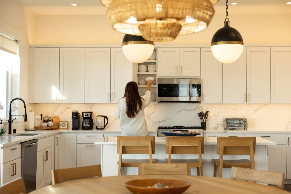 {Kitchen} Designed for real cooking — top-of-the-line cookware, stocked spices, containers, and everything you need to make meals feel like home.