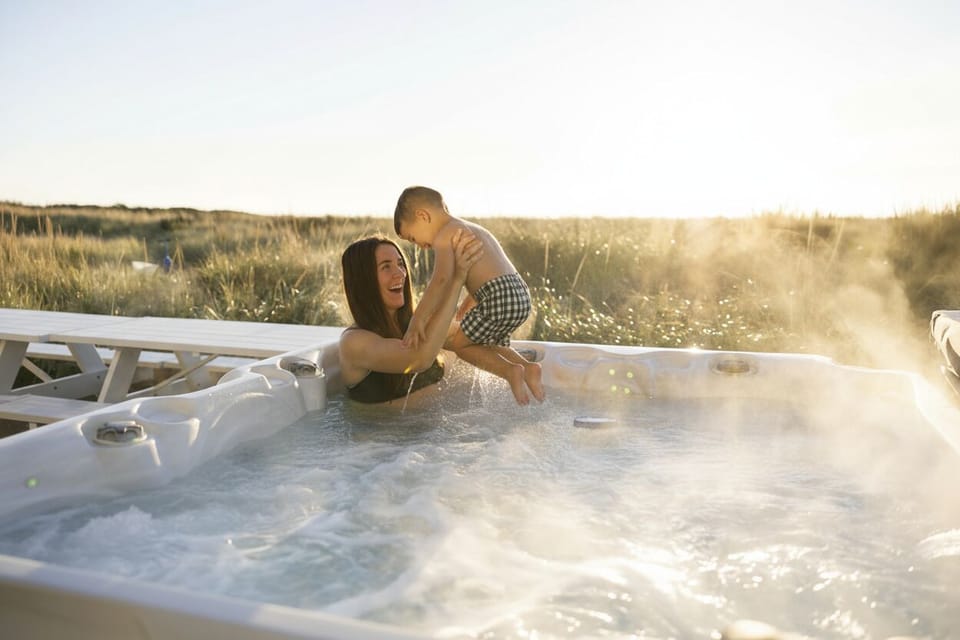 {Hot Tub} Enjoy the heated oceanfront hot tub year-round, with seating for up to 6.