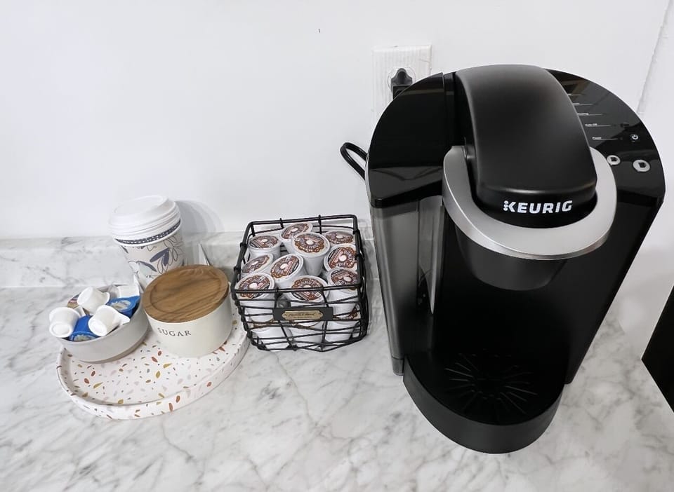 Keurig, coffee, creamer, and snacks are provided 
