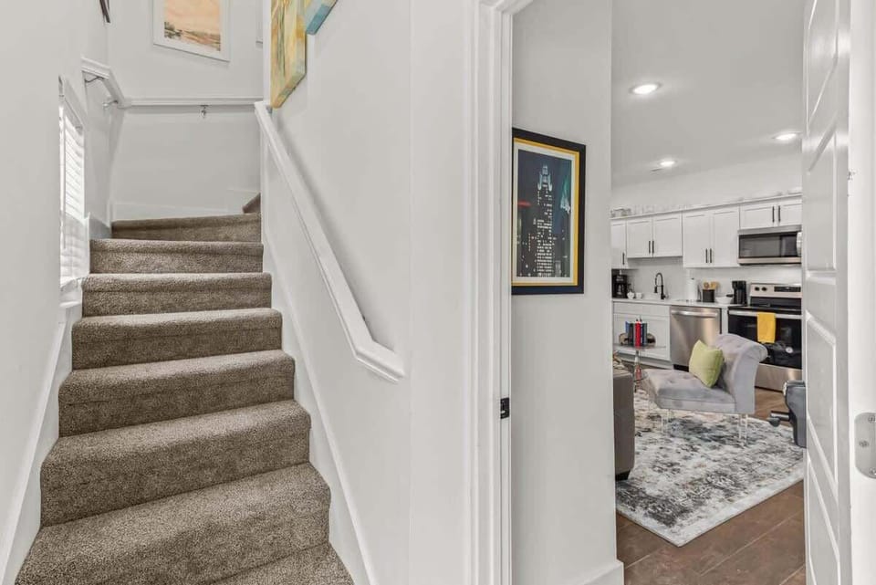 Step into style through our welcoming entryway and stairwell leading into your relaxing retreat.