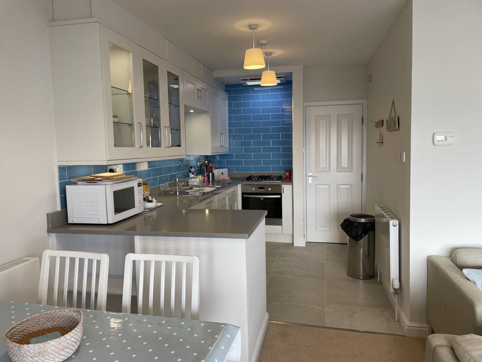 Modern kitchen close to dining area