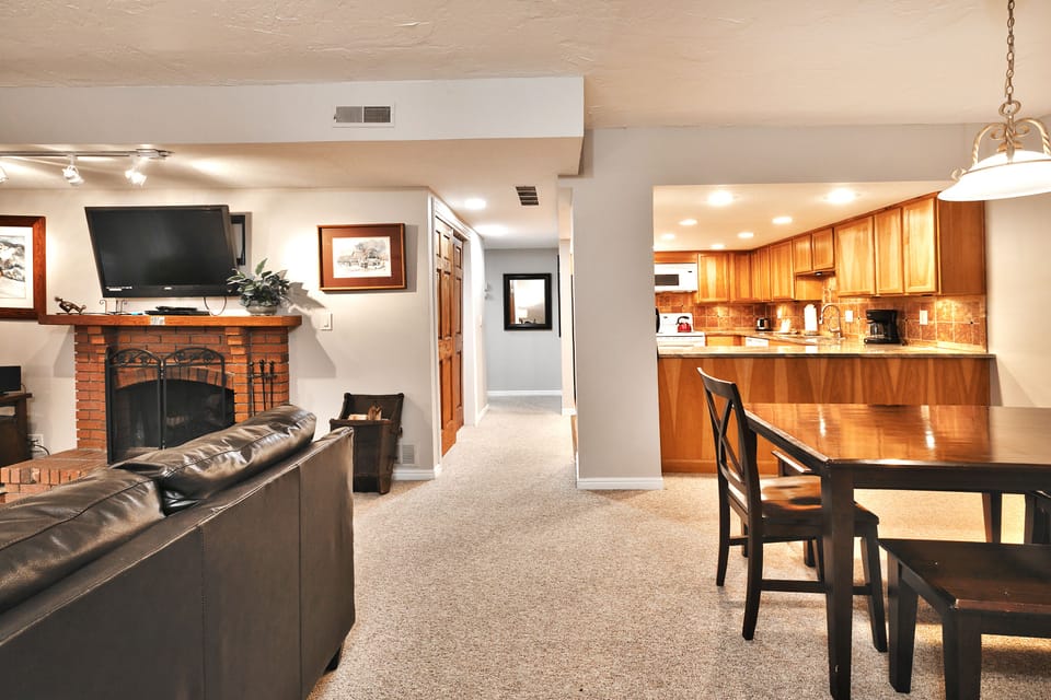 - Open layout with fireplace kitchen and dining area  
- Fully equipped kitchen with granite countertops nearby  
- Comfortable living space perfect for gathering together