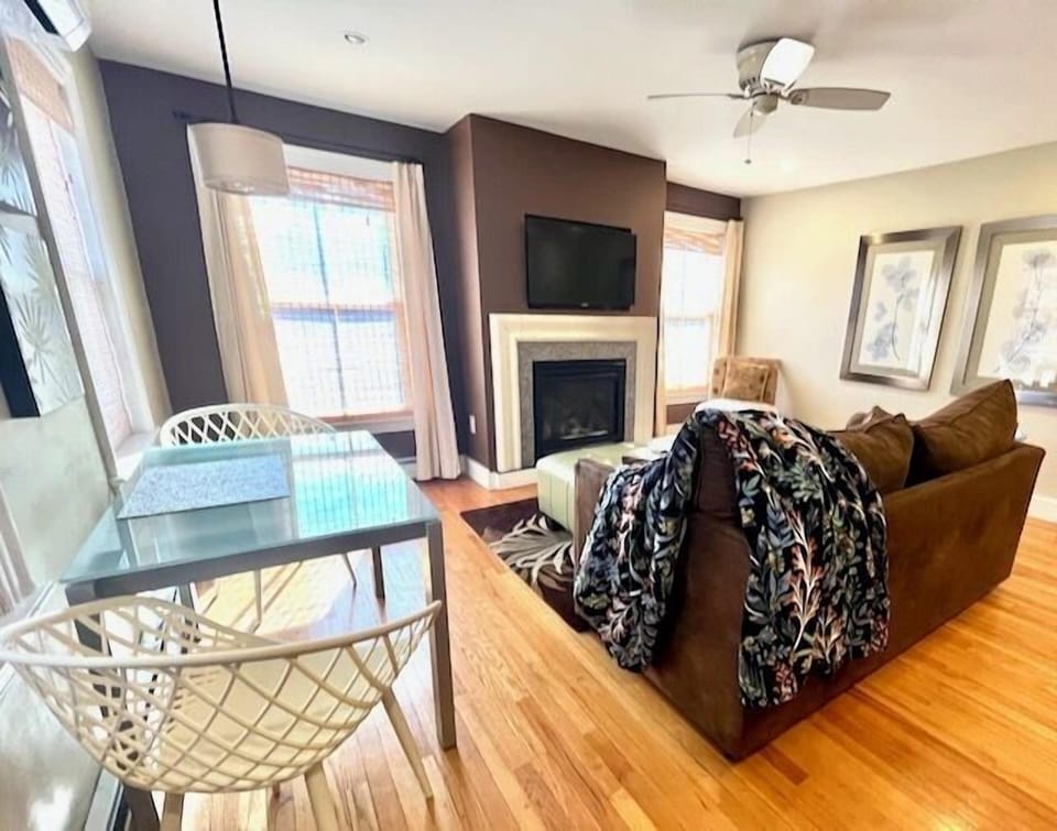 Living Room with dining area, fireplace and kitchen