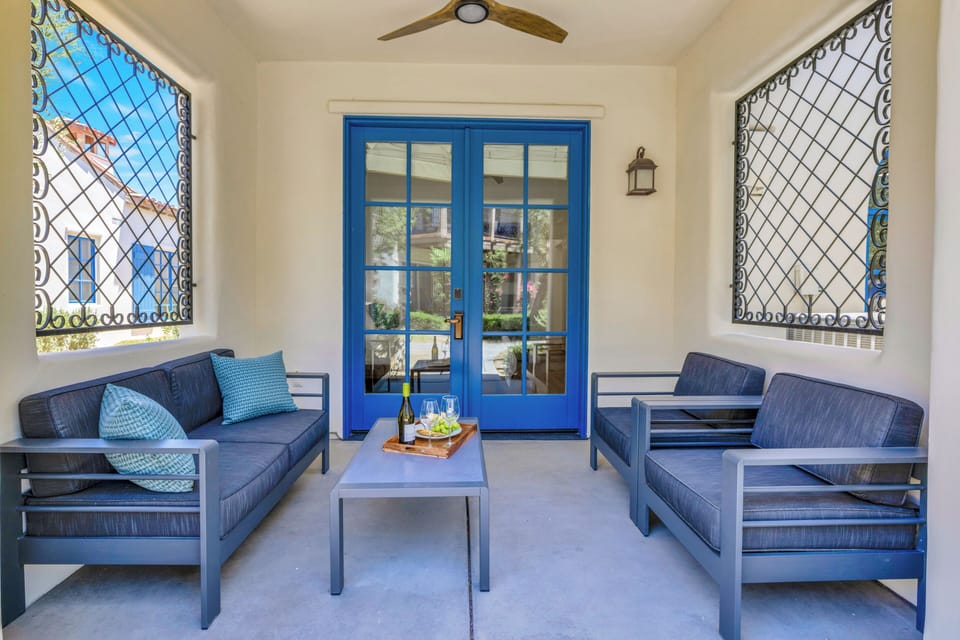 Comfy sofa and chairs on bedroom two private patio.