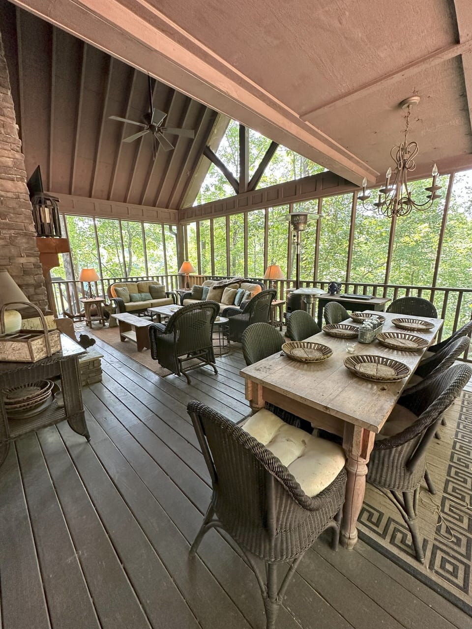 Large dining table on screened porch enhances family get-togethers.