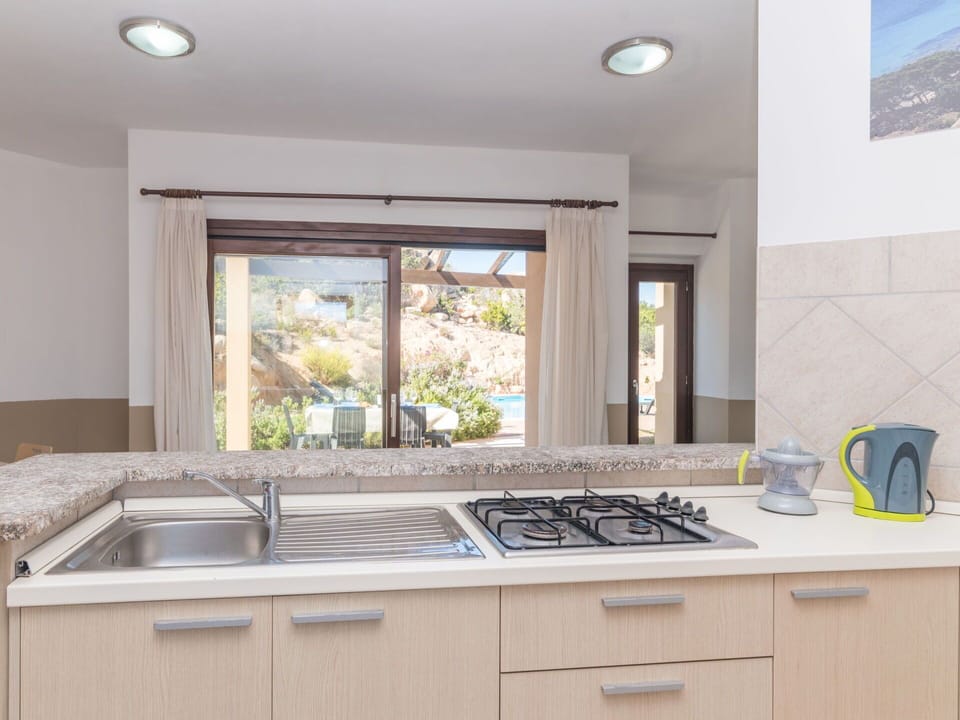 Cabinetry, Kitchen Sink, Tap, Countertop, Building, Sink, Window, Interior Design, Wood, Lighting