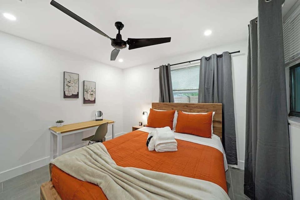 The soothing ambiance is complemented by a ceiling fan overhead, ensuring a pleasant temperature year-round.