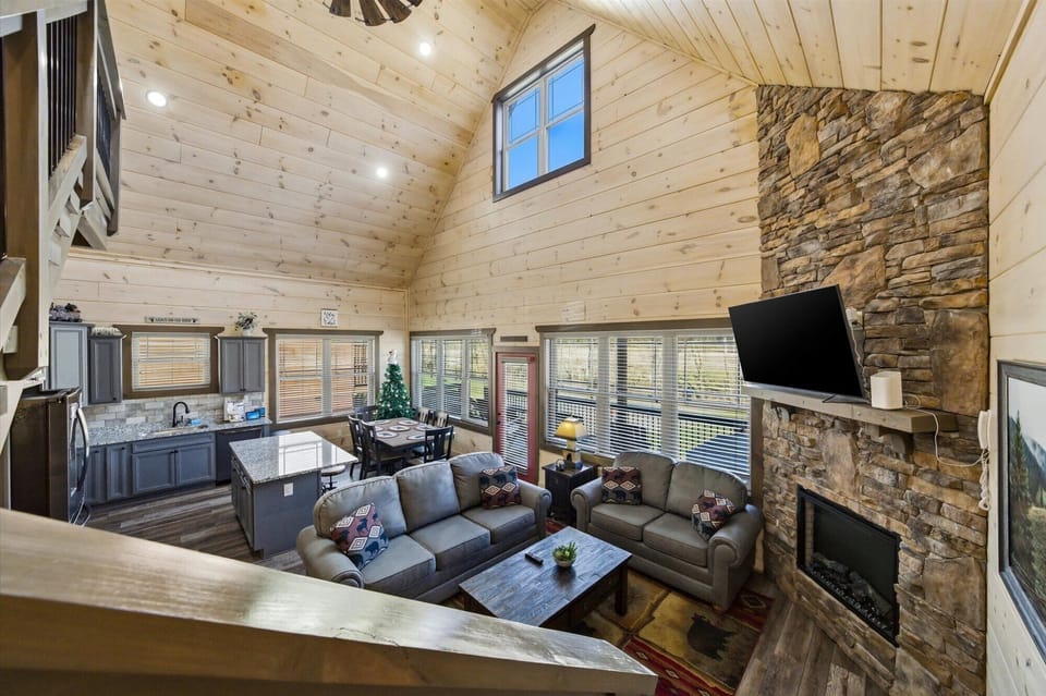 Gather around your spacious stone fireplace where soaring wood-beam ceilings and cozy leather seating create the perfect mountain retreat atmosphere.