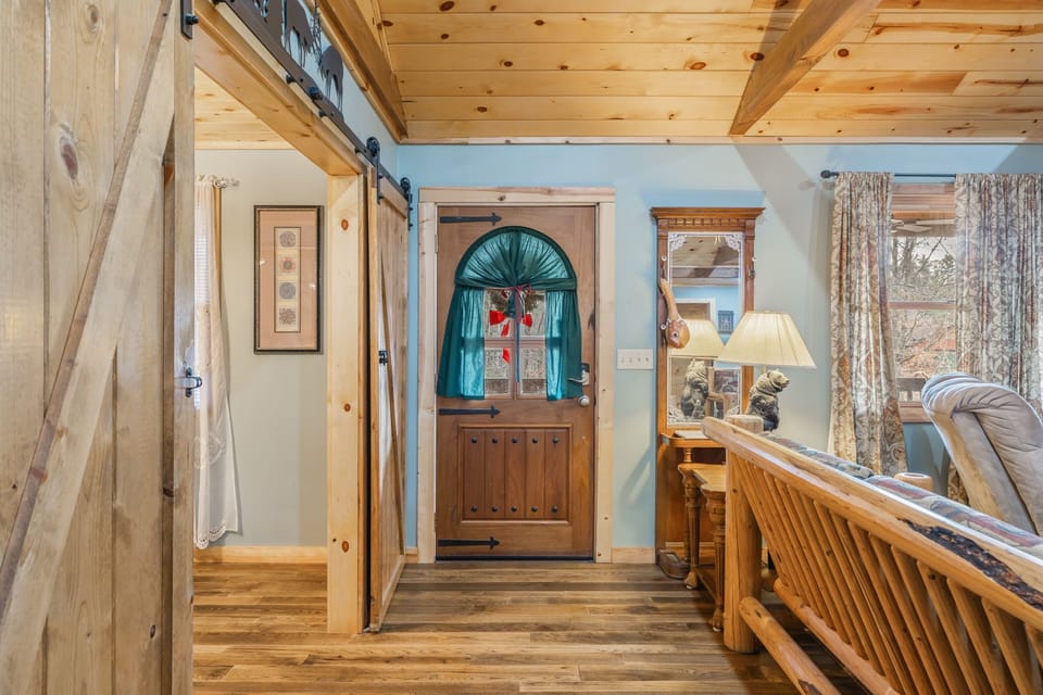 Step into your cozy retreat where rustic wooden beams and charming details create the perfect mountain getaway atmosphere.
