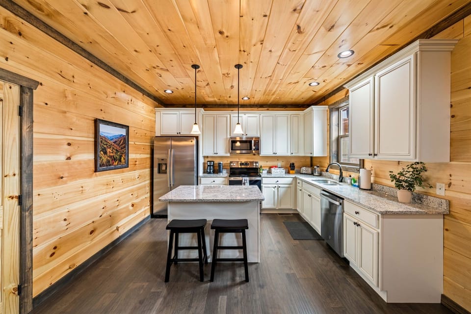 Fully stocked kitchen w/ stainless steel appliances.