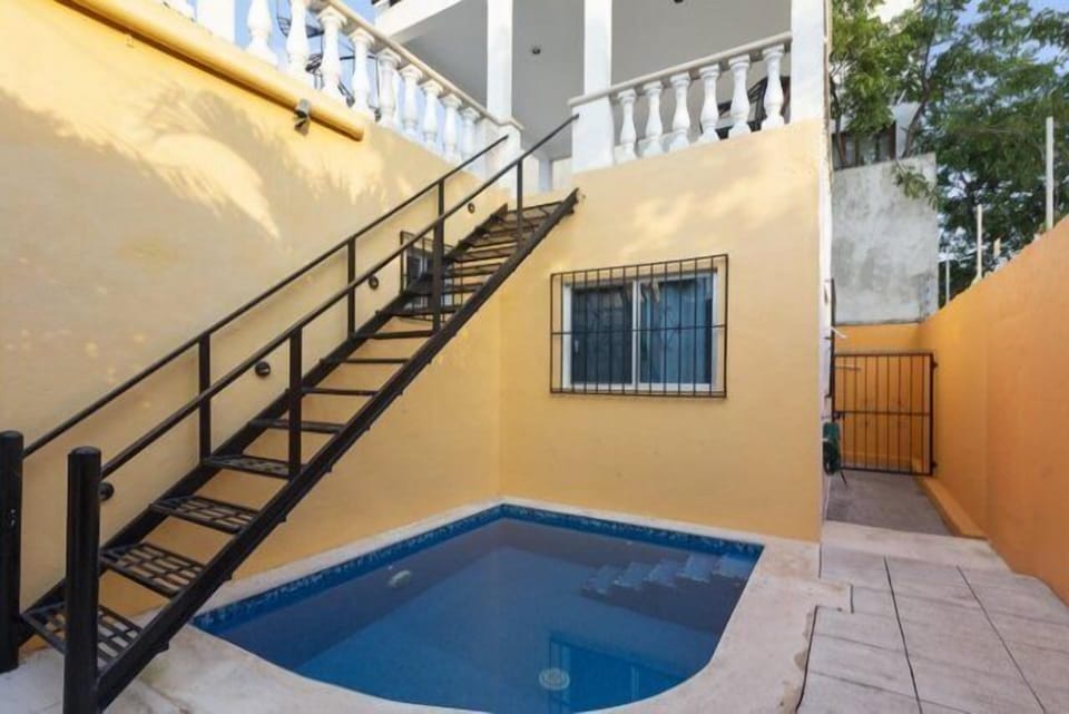 The small dipping pool in the backyard. The stairs lead to the rooftop terrace.