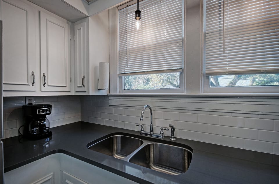 The kitchen has a 12-cup programmable coffee maker, coffee, sugar, and powdered creamer.