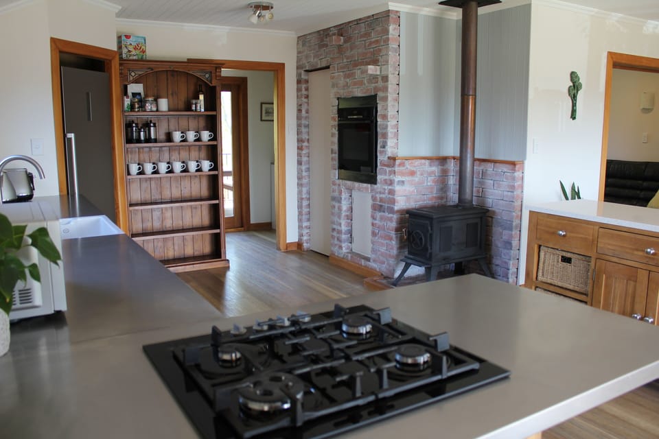 Kitchen has a new gas hob and new oven, with a woodburning stove.