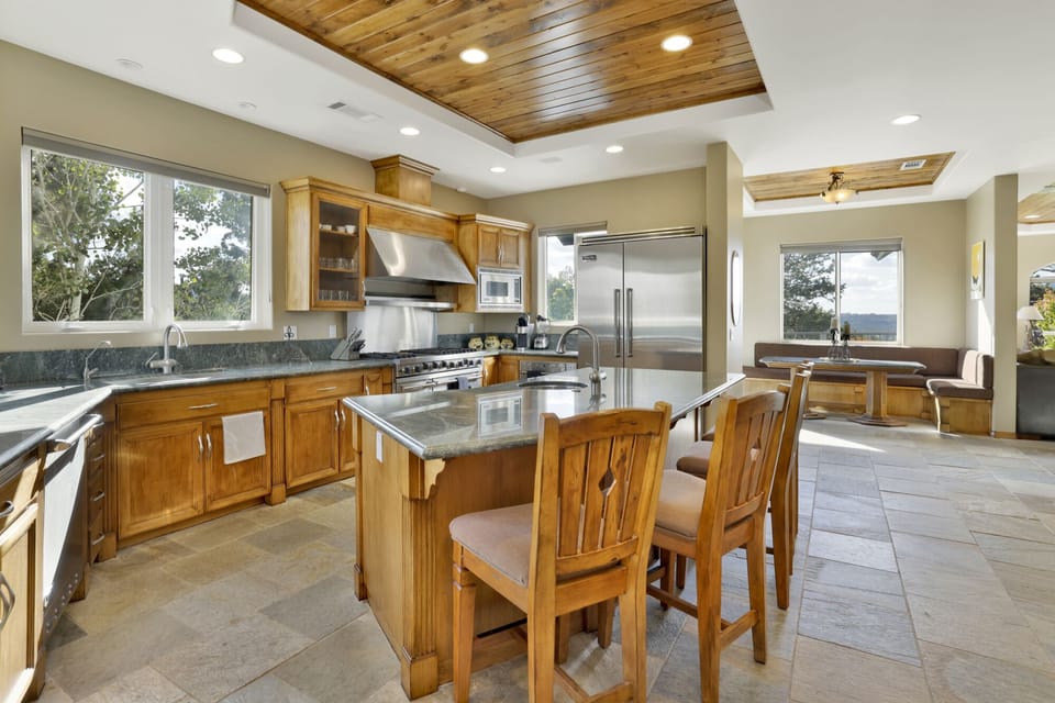 Fully equipped cabin kitchen with ample cabinetry, stove, fridge, microwave, and coffee maker—perfect for cooking meals, morning coffee, and feeling right at home on your stay.