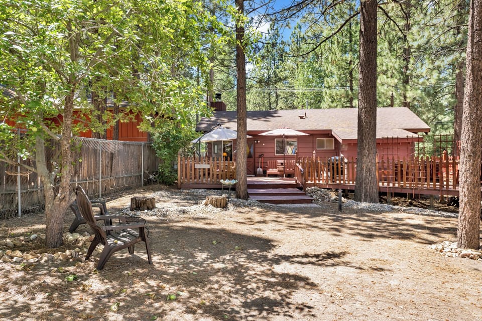 Private outdoor deck, surrounded by tall pines, perfect for relaxing under the trees after a day of adventure—enjoy peaceful forest views, fresh air, and a truly rejuvenating stay.