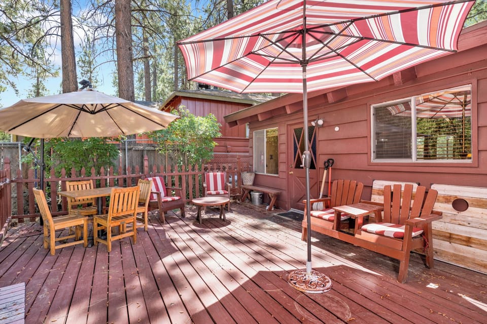 Private outdoor deck, surrounded by tall pines, perfect for relaxing under the trees after a day of adventure—enjoy peaceful forest views, fresh air, and a truly rejuvenating stay.