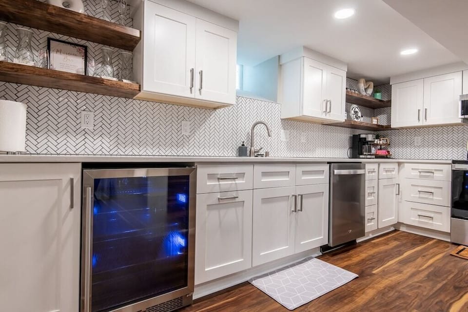 Basement kitchen with mini fridge and mimosa bar 