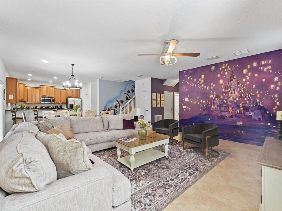 Relax with our beautiful mural,  comfortable sofa, & 75" Roku TV downstairs.