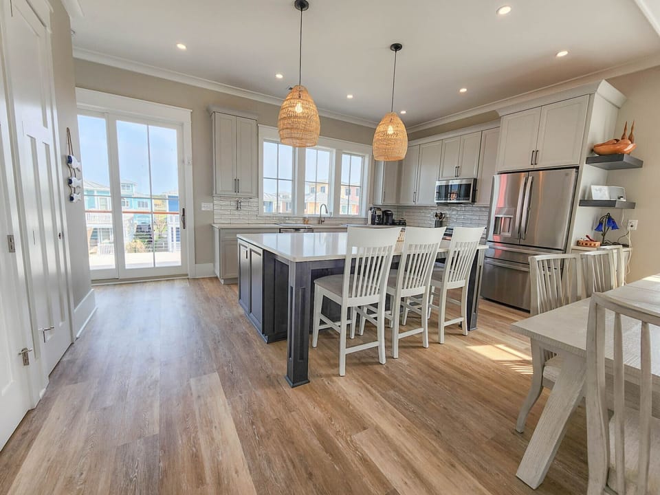 The kitchen island has seating for 3