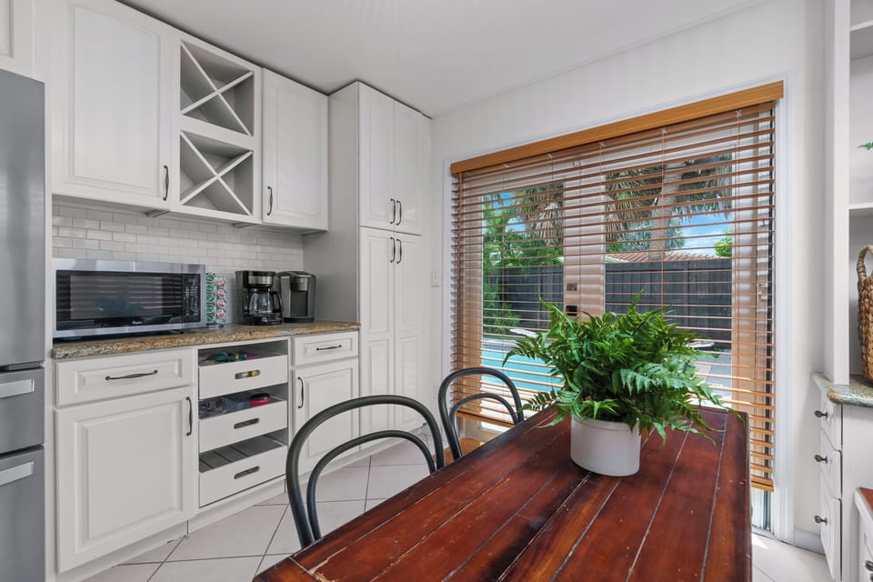 Wake up to pool views in this kitchen w/ fridge, microwave, coffee maker & more!
