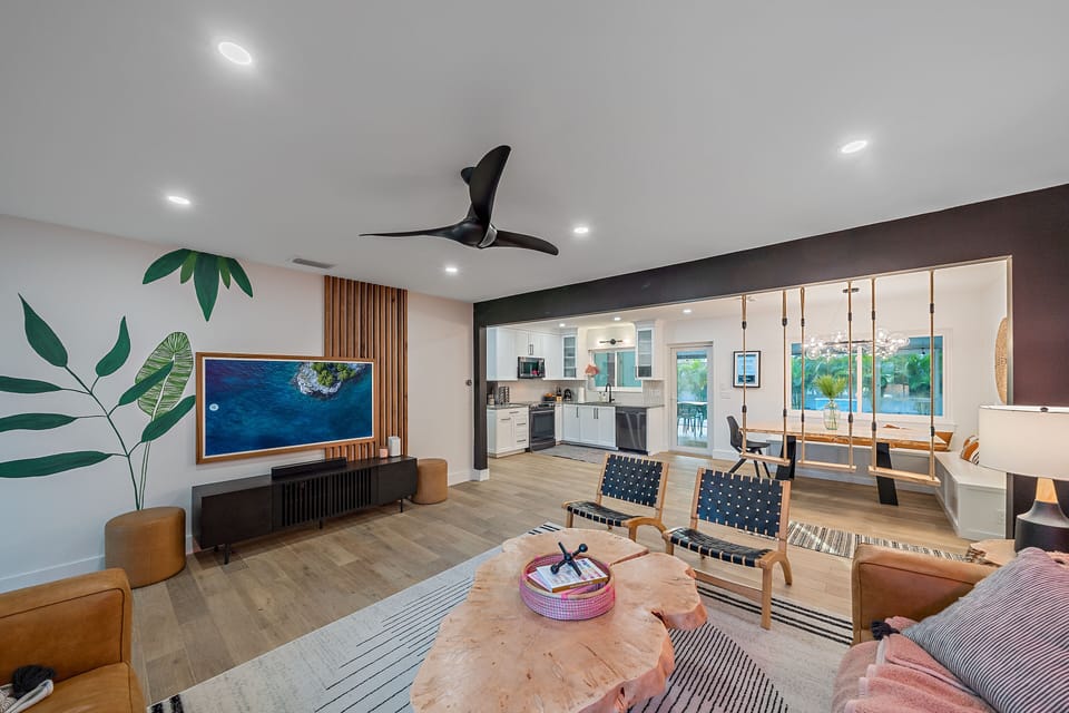 Smart TV disguised as art on the entrance wall is perfect for a movie night in - sign into your preferred streaming service to catch up on all of your favorite TV shows while on vacation.