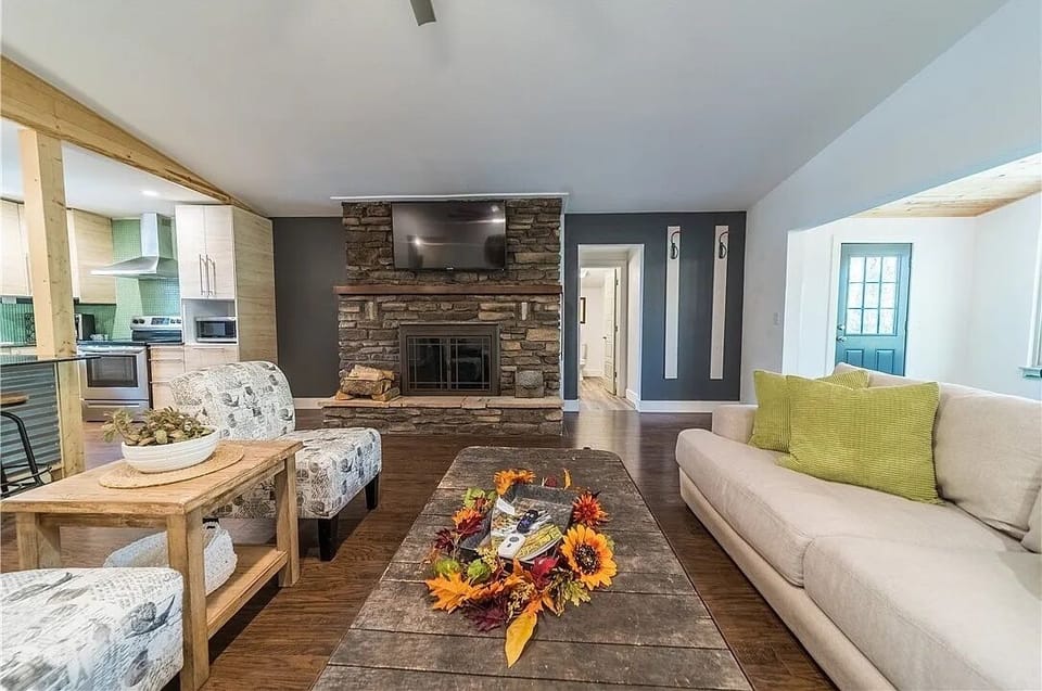 Enjoy this spacious living area where the floor to ceiling fireplace captivates!