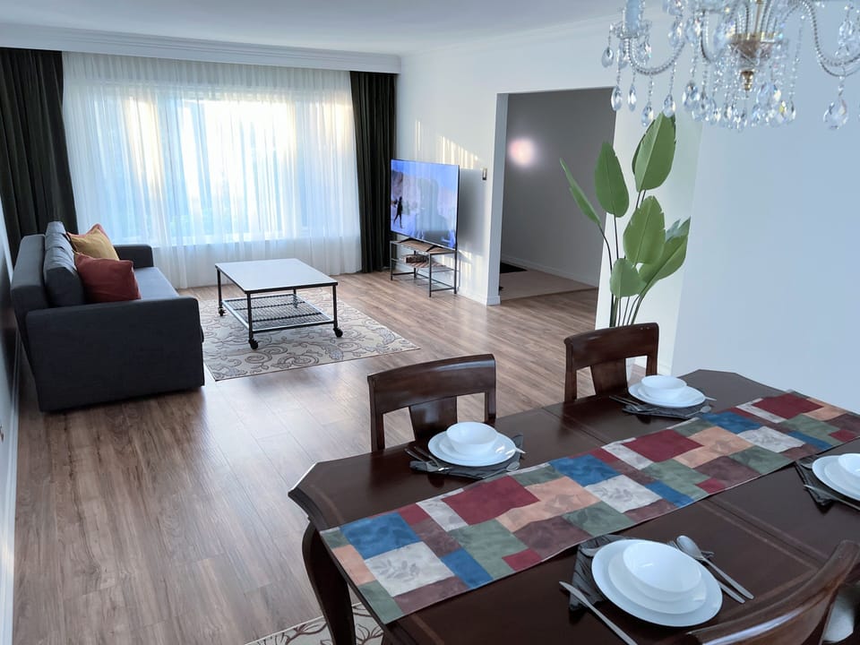 Living room with entertainment and dining areas