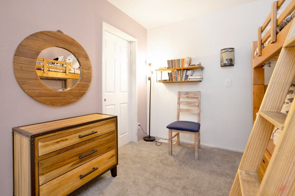 Peaceful cabin bedroom with plush bedding, and beautiful views—ideal for restful nights, cozy mornings, and a relaxing mountain escape.