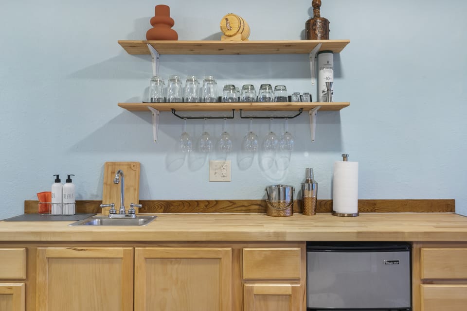 Mix up drinks and snacks at the full wet bar 