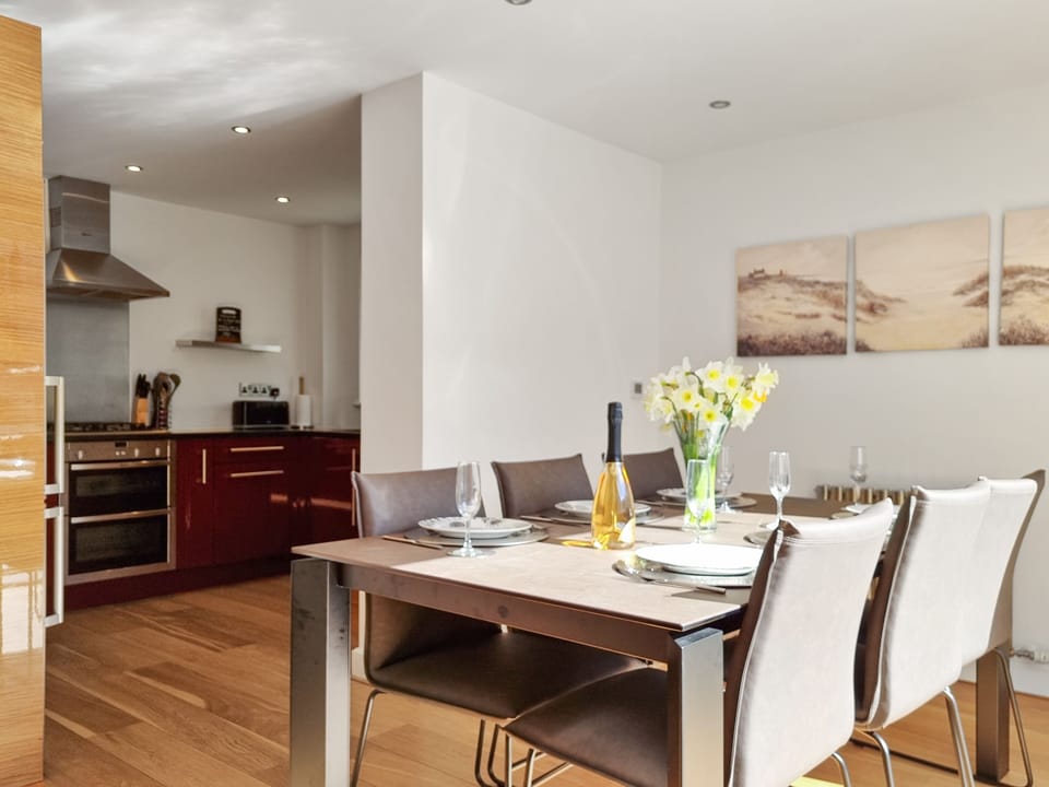 2 Point View - Dining Area leading to the kitchen with in-built Neff appliances.