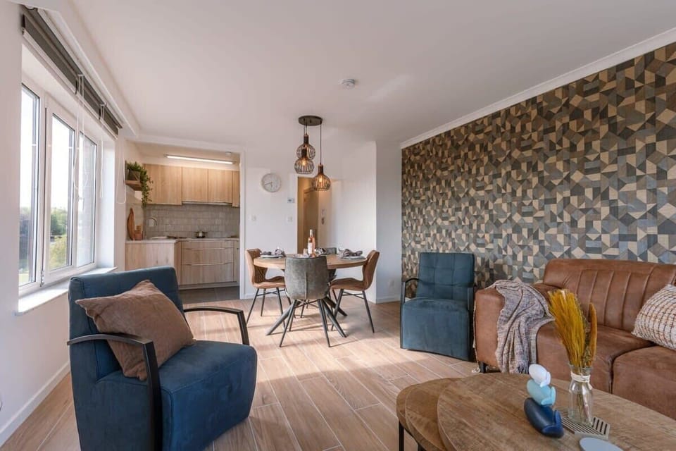 Open living space blending warmth, comfort, and a contemporary coastal vibe.

